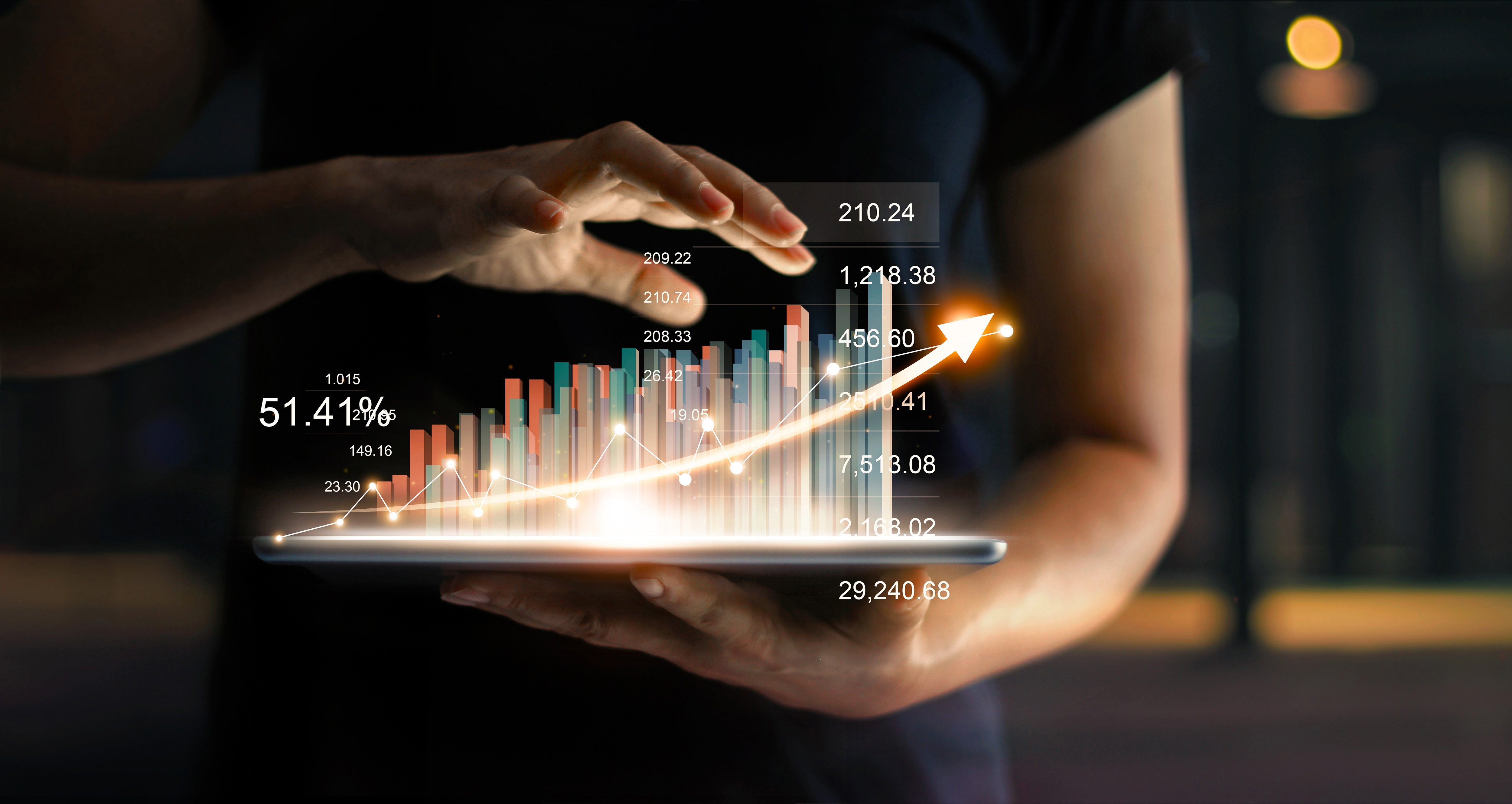 businessman-holding-tablet-showing-growing-virtual-hologram-statistics-graph-chart-with-arrow-up (1)